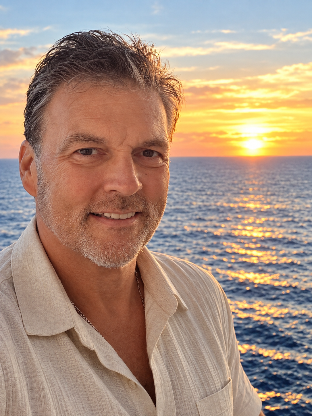 Duncan Wierman by the ocean at sunset